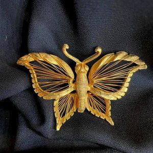 Gold-plated butterfly broach with fluttering wings!